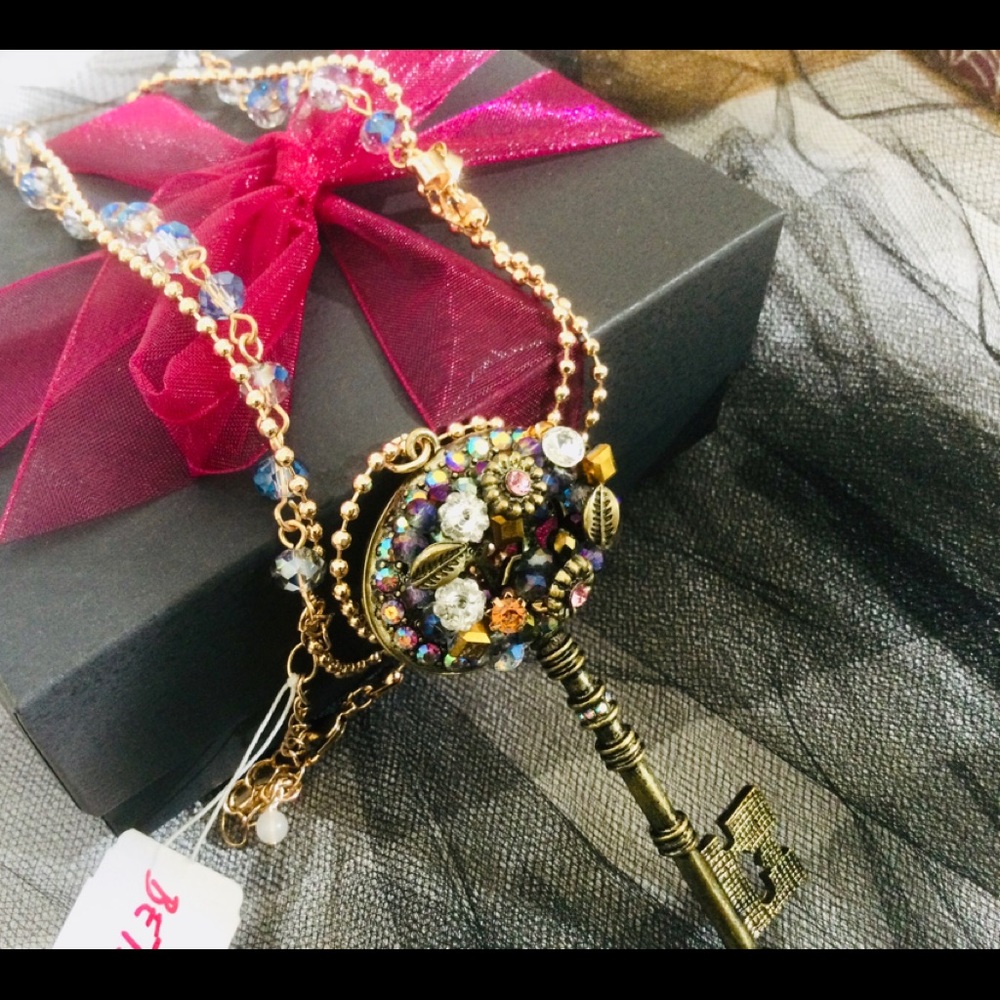 Fabulous Betsey Johnson, jeweled crystal key pendant with 34inch chain.